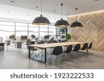 Modern eco style interior in open space office with big windows, wooden wall and conference table and concrete floor. 3D rendering