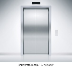 Modern elevator or lift doors made of metal closed in building with lighting.