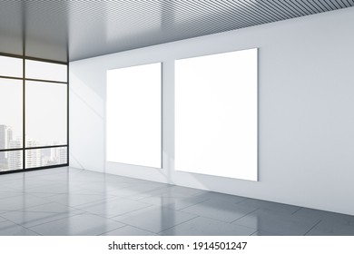 Modern empty office with city view and two blank white mockup posters on light grey wall and glossy floor. Mockup. 3D rendering