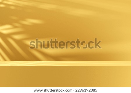 Modern empty yellow rectangular podium, platform or pedestal. Leaf shadow on the wall with natural daylight. Background for product display. 3D render.