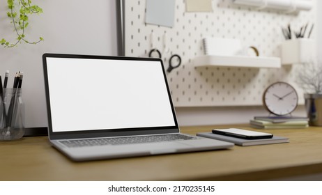 Modern High School Or College Student Home Workspace With Portable Laptop Computer Mockup, Stationery And Decor On Wood Table, Minimal White Pegboard On The Wall. 3d Rendering, 3d Illustration