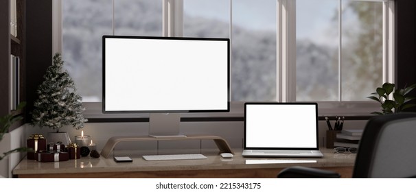 Modern Home Workspace On Christmas Seasonal Interior With PC Desktop Computer And Laptop In White Screen Mockup, Accessories And Christmas Tree On Table Against Window. 3d Render, 3d Illustration