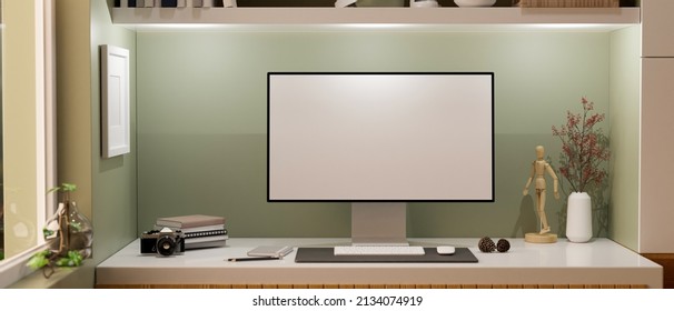 Modern Home Workstation With Pc Desktop Computer Blank Screen Mockup, Keyboard, Mouse, Camera And Supplies On Table Against Green Wall. 3d Rendering, 3d Illustration