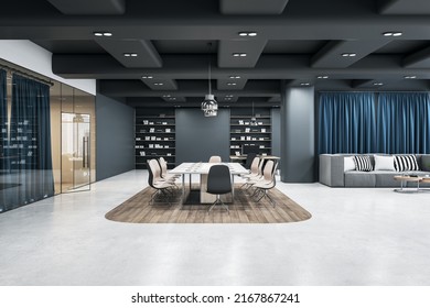 Modern Interior Design Office Hall With Stylish Conference Table Surrounded By Chairs On Wooden Island Among White Concrete Floor, Grey Walls, Glass Door And Cozy Big Sofa In Lounge Zone. 3D Rendering