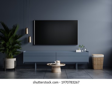 Modern Interior Of Living Room With Tv On The Cabinet On Dark Blue Wall Background,3d Rendering