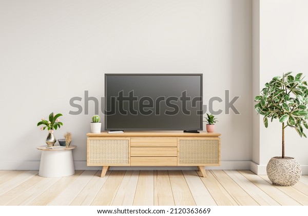 Modern interior with TV and cabinet on white\
color wall background.3D\
rendering