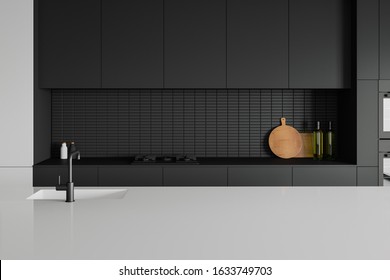 Modern kitchen interior. Closed black matte kitchen unit with sink, cut board and stove on a glossy white kitchen worktop. 3d rendering