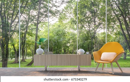 Modern Living Room In The Glass House 3d Render Image.There Are Large Window Overlooking To The Garden And Nature And Finished With Yellow Fabric Armchair And Wooden Cabinet