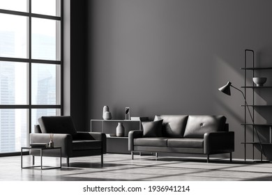 Modern Living Room Interior, Black Wall And Panoramic Window With Singapore City View. Dark Grey Sofa And Armchair, Coffee Table, Bookshelves, Lamp And Chest Of Drawers. Concrete Floor. 3D Rendering