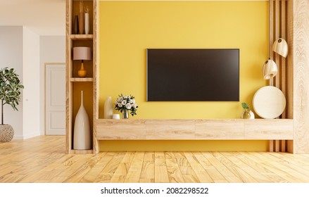 Modern Living Room Interior With Shelf For TV On Yellow Color Wall Background.3d Rendering