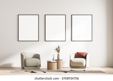 Modern Living Room Interior With Two Armchairs And Small Table. Three Mock Up Framed Posters On White Wall. Reading And Relax Concept. No People. 3d Rendering.