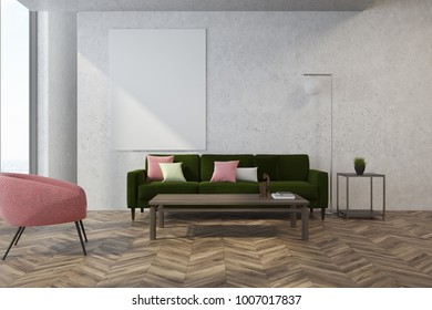 Modern living room interior with a wooden floor, concrete walls and a green sofa with a pink armchair near a vertical poster and a coffee table. 3d rendering mock up - Shutterstock ID 1007017837