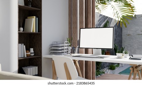 Modern Luxury Home Office Interior Design With Computer White Screen Mockup And Office Supplies On The Table Against The Window With Pool View In Background. 3d Rendering, 3d Illustration