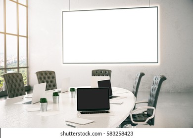 Modern Meeting Room With Empty Laptop Screen And Blank Whiteboard. Mock Up, 3D Rendering