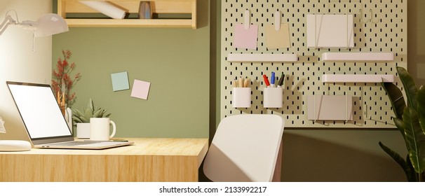 Modern Minimal Workspace In College Dorm Apartment With Portable Laptop Computer Mockup, Stationery And Decor On Table, Chair, Shelves On Green Wall. 3d Rendering, 3d Illustration