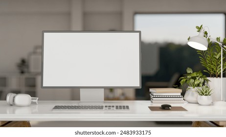 A modern office features a computer with a white-screen mockup, headphones, books, a table lamp, and decor plants on the table. workspace concept. 3d render, 3d illustration