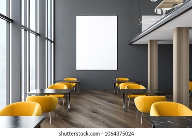 Modern Office Staff Room Or Classroom With Dark Gray Walls, Loft Windows, Wooden Floor, Square Desks And Yellow Chairs. A Vertical Poster. 3d Rendering Mock Up