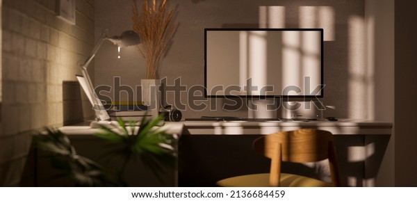Modern office workstation\
interior background with computer desktop mockup, table lamp and\
office supplies in the low light room. 3d rendering, 3d\
illustration