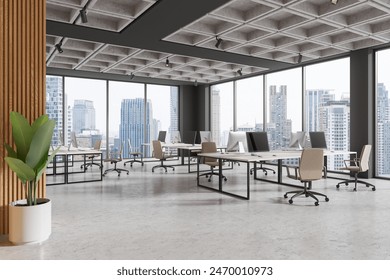 Modern open office space with cityscape view, minimalist interior design featuring a large plant. Bright workspace concept.  3D Rendering - Powered by Shutterstock