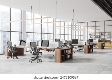 Modern open-plan office with desks and computers, large windows with city buildings view, spacious and bright environment, workplace concept,  3D Rendering - Powered by Shutterstock