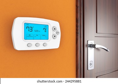 Modern Programming Thermostat On A Wall Near Door