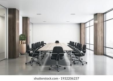 Modern spacious meeting room with wooden table and columns, black chairs on concrete floor and city view from big window. 3D rendering