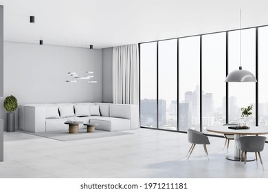 Modern Spacious Sunny Living Room With Huge Sofa, City View From Big Window, Glossy Marble Floor, Stylish Dinner Table And Round Lamp From Top. 3D Rendering