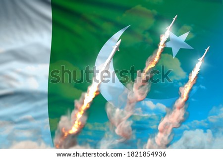 Modern strategic rocket forces concept on blue sky background, Pakistan nuclear warhead attack - military industrial 3D illustration, nuke with flag