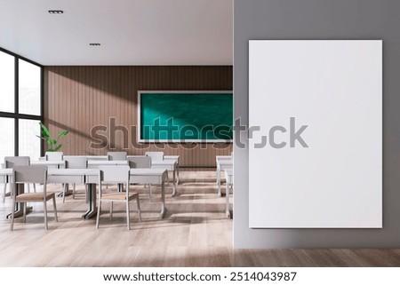 Modern stylish classroom interior with empty white mock up banner, panoramic window and city view, wooden floor and green blackboard on wall. School, university and education concept. 3D Rendering