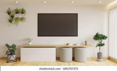 Modern TV Room Is Decorated With Plants And Sofas. It Has A Large TV On A Beautiful White Wall.3d Rendering