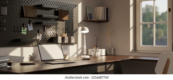 Modern Urban Home Workspace Near The Window Interior Design With Laptop Blank Screen Mockup And Accessories On Wood Table, Black Pegboard On White Wall. 3d Render, 3d Illustration