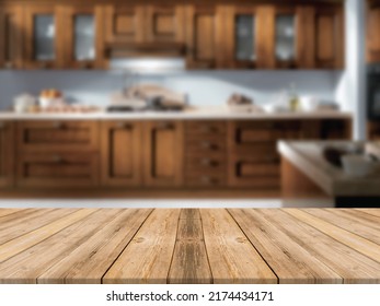 Modern Vintage Wooden Kitchen Island With Montage Space Over A Blurred Contemporary Vintage And Dark Toned Kitchen Interior.