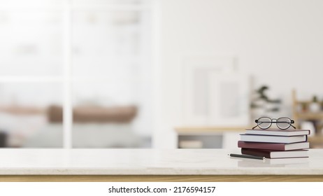 Modern White Tabletop With Empty Space For Montage Your Product Display With Eyeglasses On The Book Over Blurred Living Room In The Background. Close-up Image. 3d Rendering, 3d Illustration