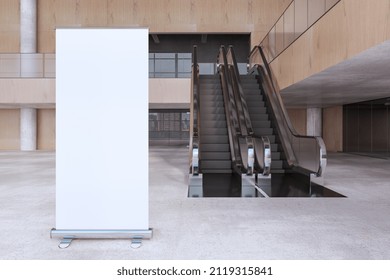 Modern Wooden And Concrete Empty Shopping Mall Interior With Empty White Mock Up Banner, Escalator. Large Public Interiors Concept. 3D Rendering