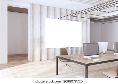 Modern Wooden And Concrete Loft Coworking Office Interior With Empty White Mock Up Presentation Banner Screen, Furniture, Computer Monitors And Daylight. Workplace And No People Concept. 3D Rendering