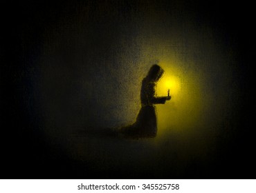 Monk Praying With A Candle