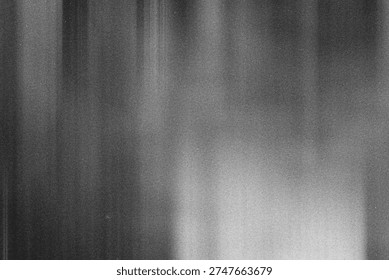 Monochromatic abstract background featuring vertical blurred lines and fine grain texture
