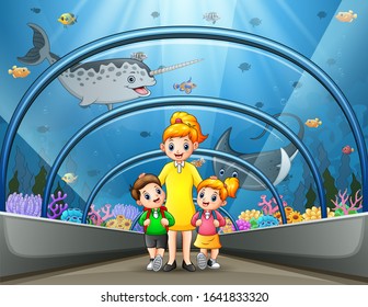 Mother And Kids Walk Thru Underwater Museum