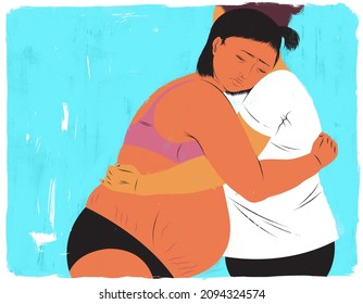 Mother in labor hugging her doula for support