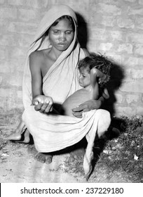 Mother Of A Starving Child Begs For Help In Calcutta In October 1943.