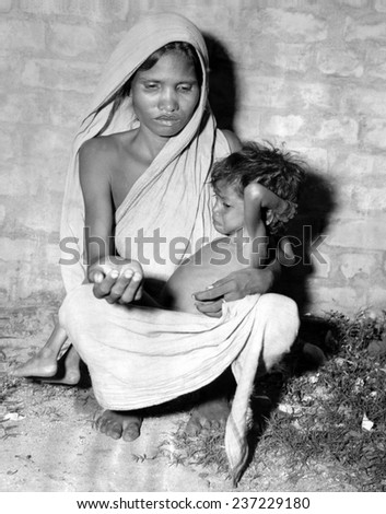 mother starving child begs