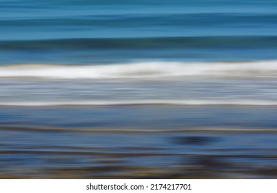 Motion blurred image of waves breaking on the shore. 