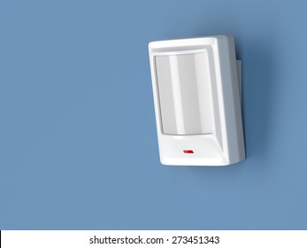 Motion Detector Attached On Blue Wall