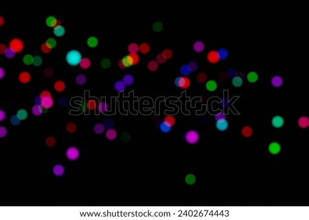 Multicolor bokeh, raining light, blurry lights, blurry background, rainbow confetti on black background, colorful, night lights, city lights, haze, depth of field, round bokeh, circle bokeh, 3d render