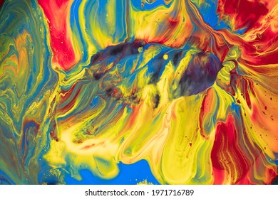 Multicolored paints create a beautiful abstract background.