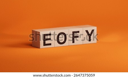 multi-colored wooden cubes with the text EOFY.close up of wooden cubes,Business Concept.3D rendering on orange background.