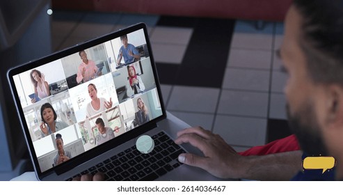 Multiple blank speech bubbles against rear view of biracial man having a image conference on laptop. Global networking and business technology concept