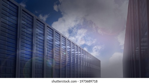 Multiple computer servers over blue sky background, data processing and technology concepts. digitally generated image
