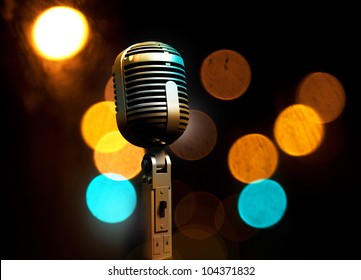 Musical background with microphone and stage lights
