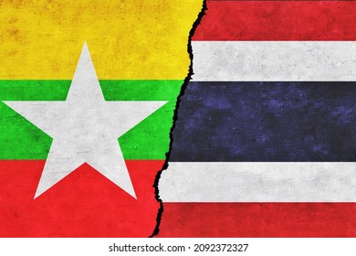 Myanmar and Thailand painted flags on a wall with a crack. Thailand and Myanmar relations. Myanmar and Thailand flags together. Thailand vs Myanmar